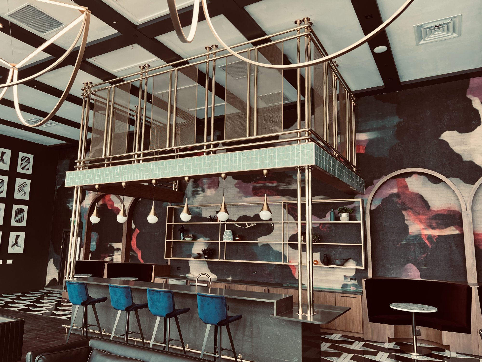 Hospitality bar with brass mezzanine