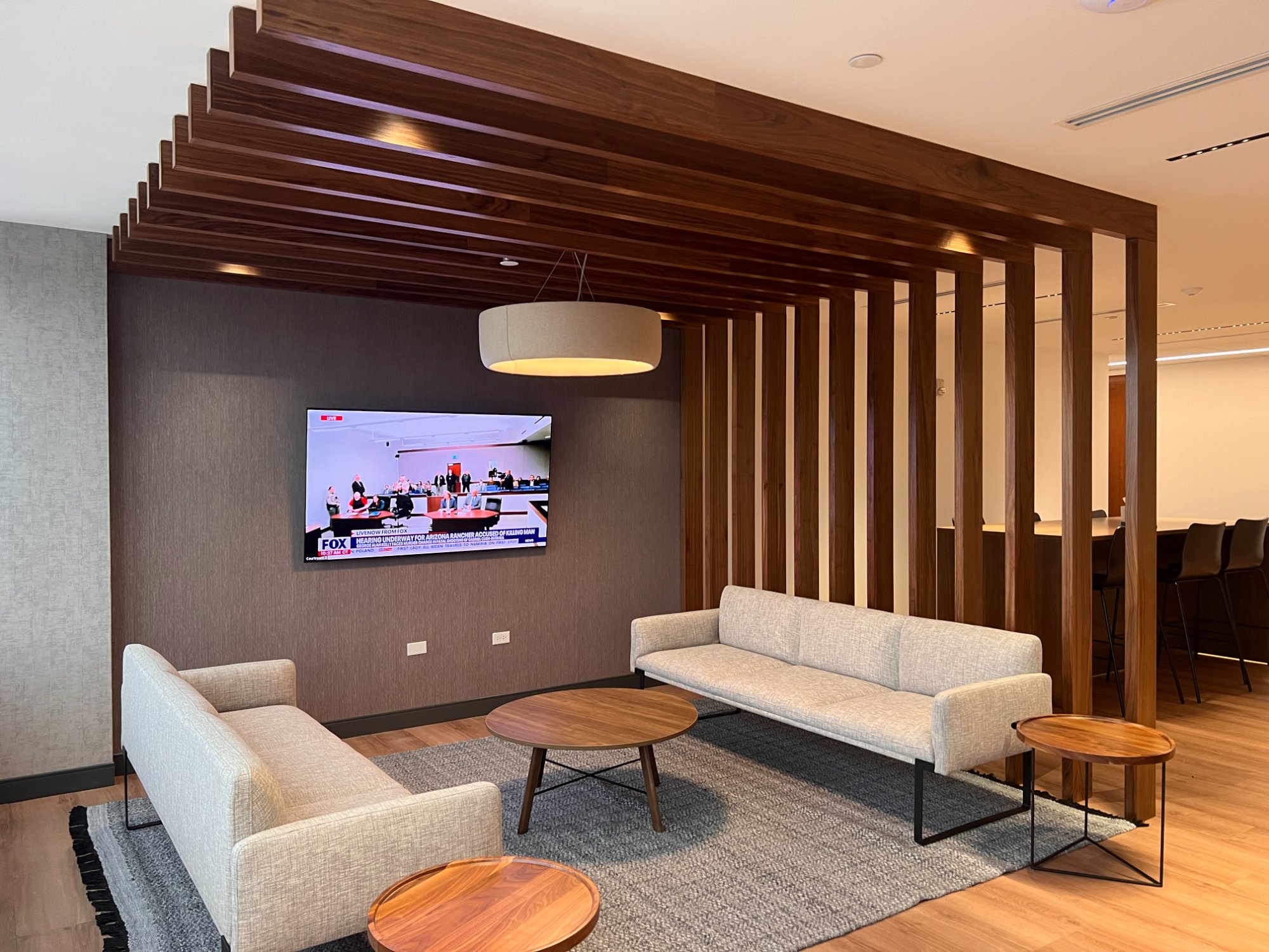 Walnut slat screen and corporate lounge